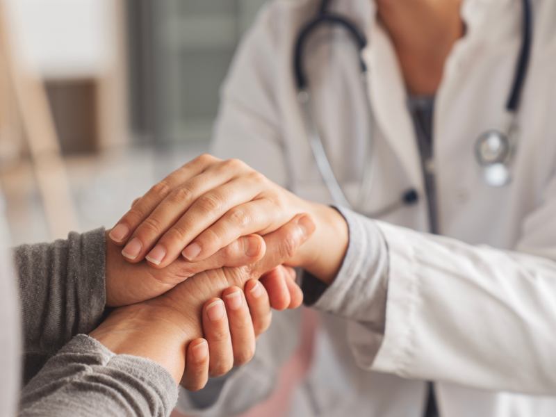 Dr & Patient Holding Hands